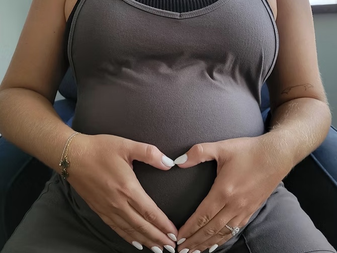 Pregnant mother in soft warm light